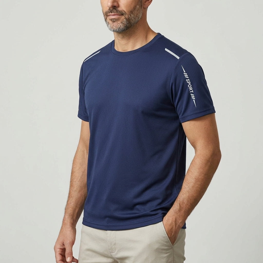 Man wearing the Davos Active Tee in Midnight Navy, three-quarter view showing the sleeve print and straight hem