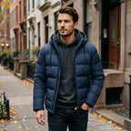 Simon Hooded Puffer Jacket in Navy Blue, worn walking down a city street in autumn